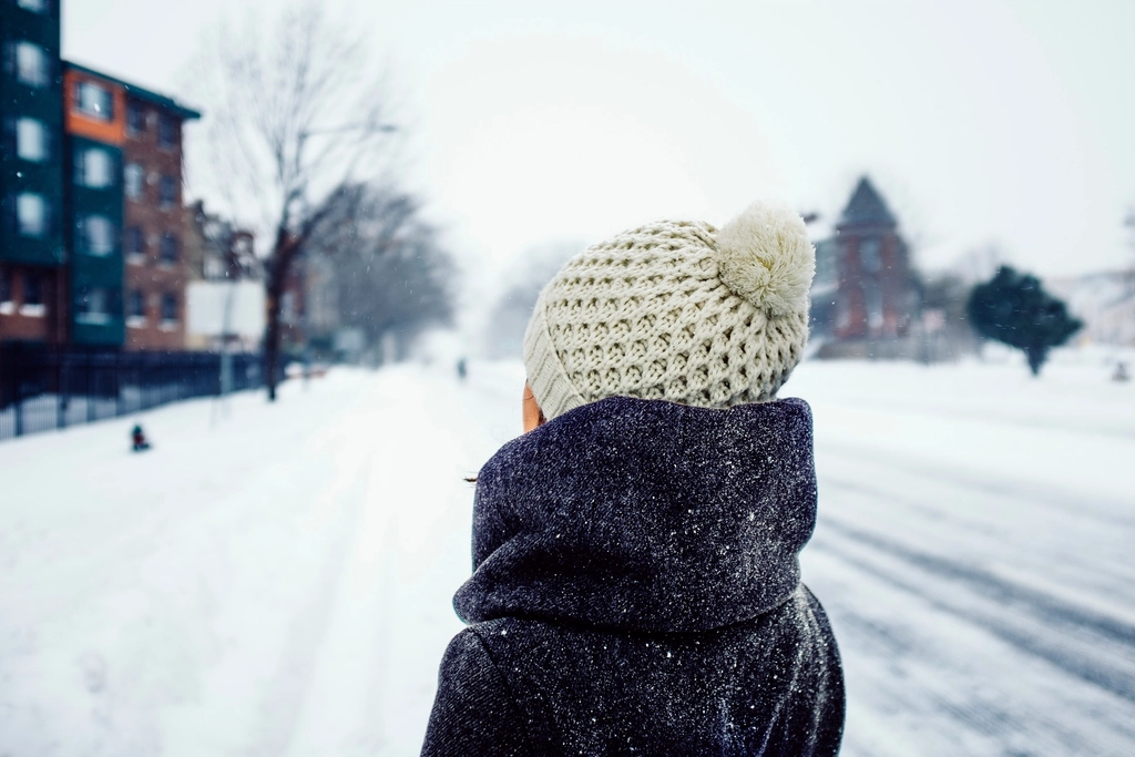 A person wearing a warm handmade hat