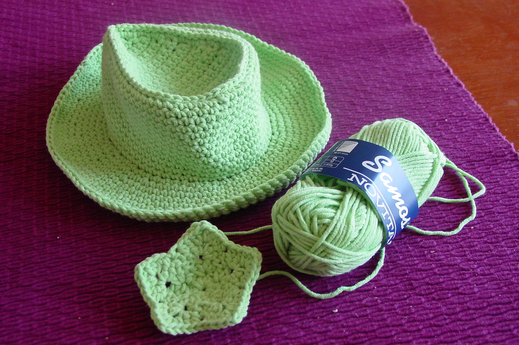 Yarn and a crochet hook on a table