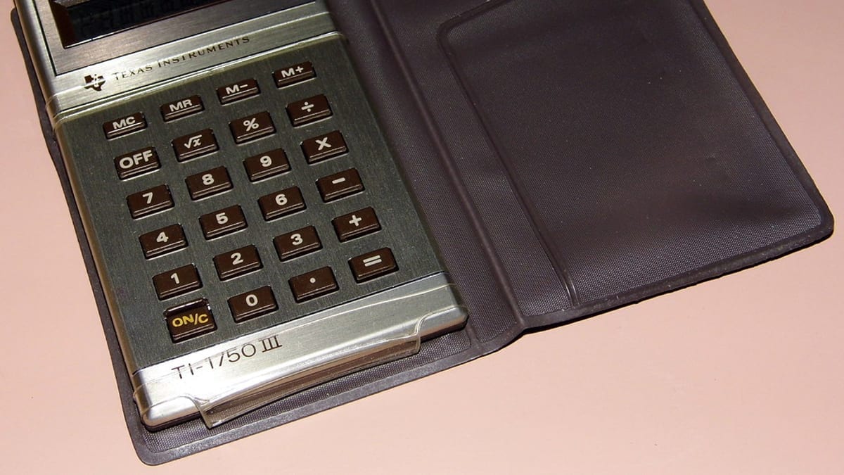 A pocket calculator in a leather case