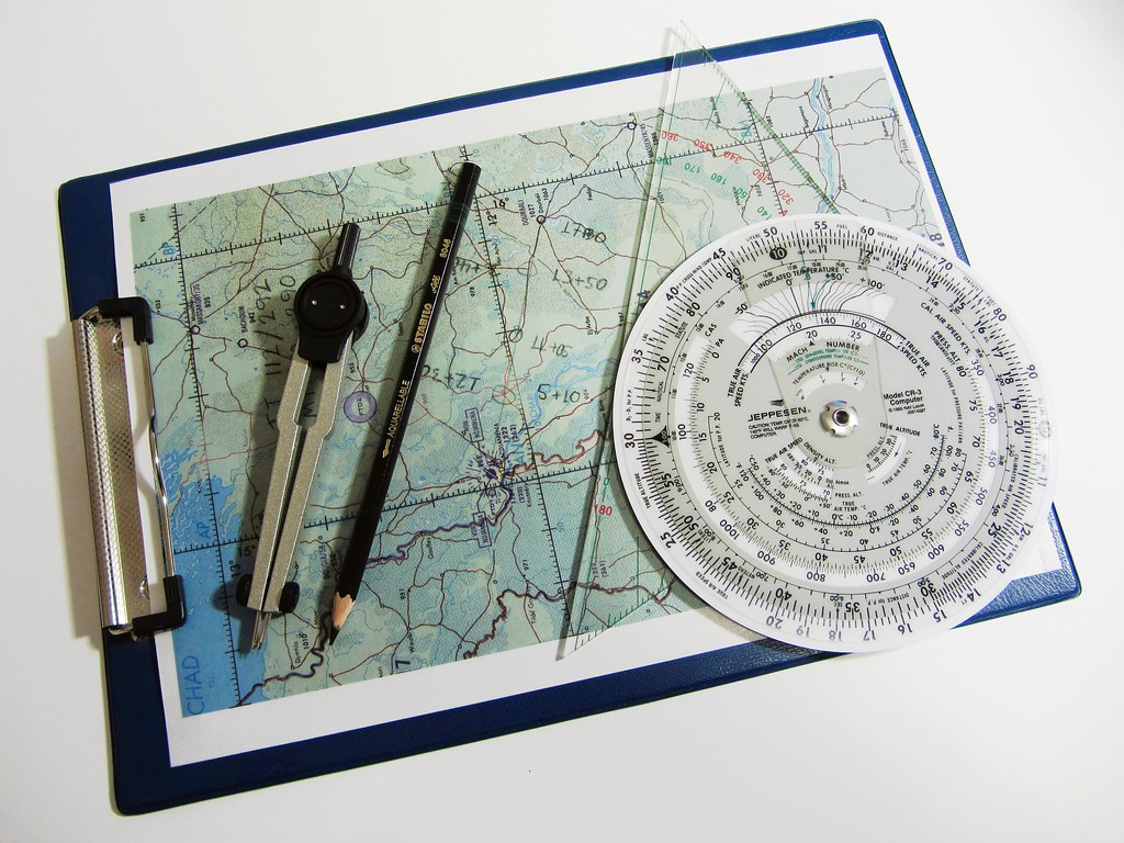 A calculator beside documents