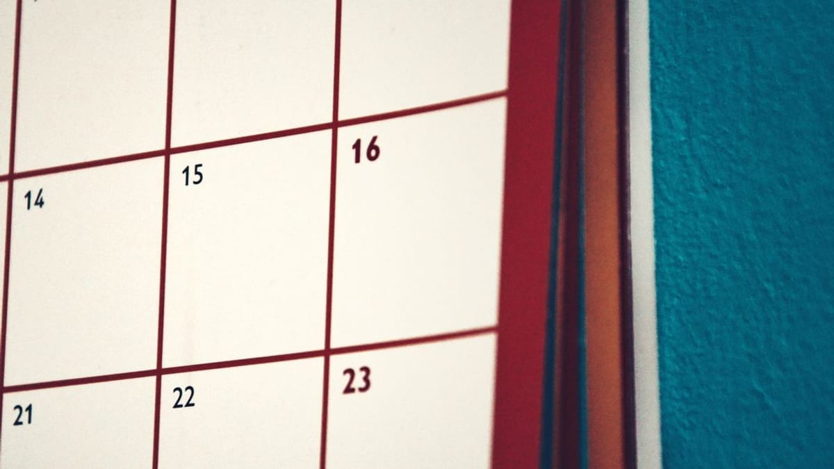 A close-up of dates on a wall calendar
