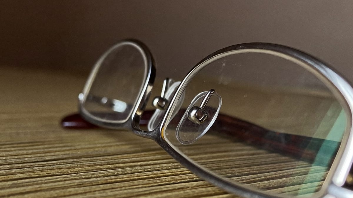 A folded pair of reading glasses in close-up