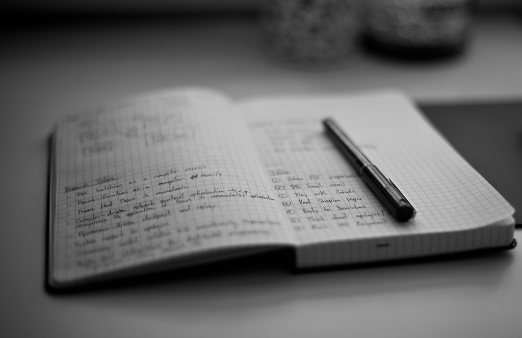A person planning finances with a notebook