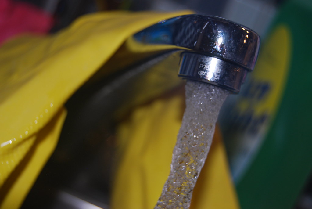 A kitchen tap running slowly