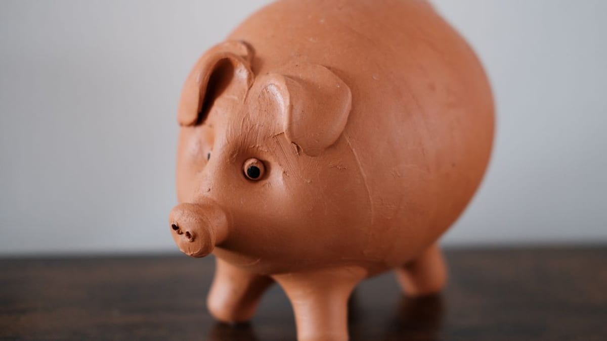 A ceramic piggy bank on a table