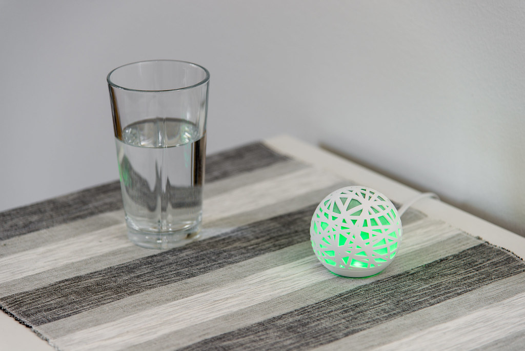 An alarm clock on a bedside table