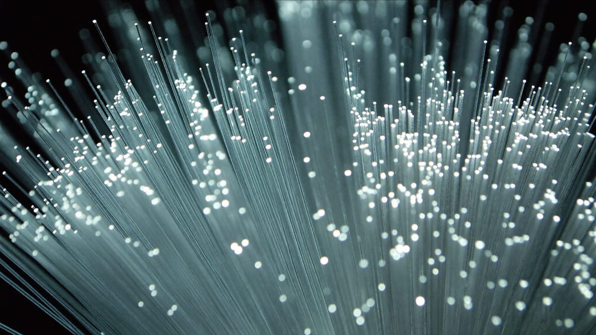 Close-up of a bundle of glowing fibre optic strands