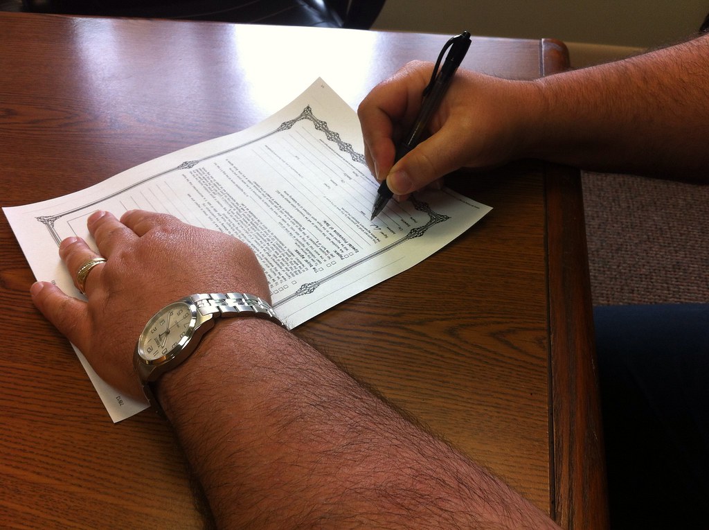 Documents being signed at a desk