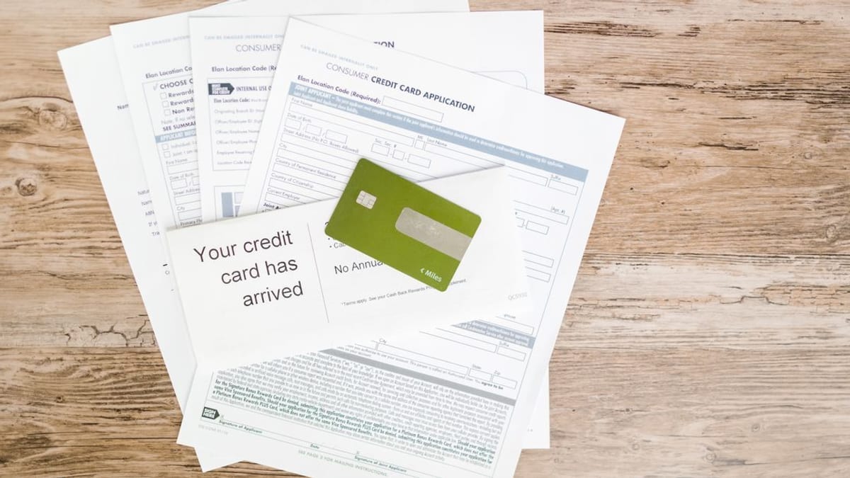 Credit card paperwork spread on a desk